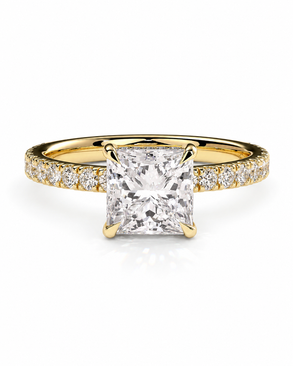 color_10K_YG, color_14K_YG &&A yellow gold engagement ring featuring a large princess-cut diamond center stone and a matching row of small diamonds along the band, set against a clean white background.
