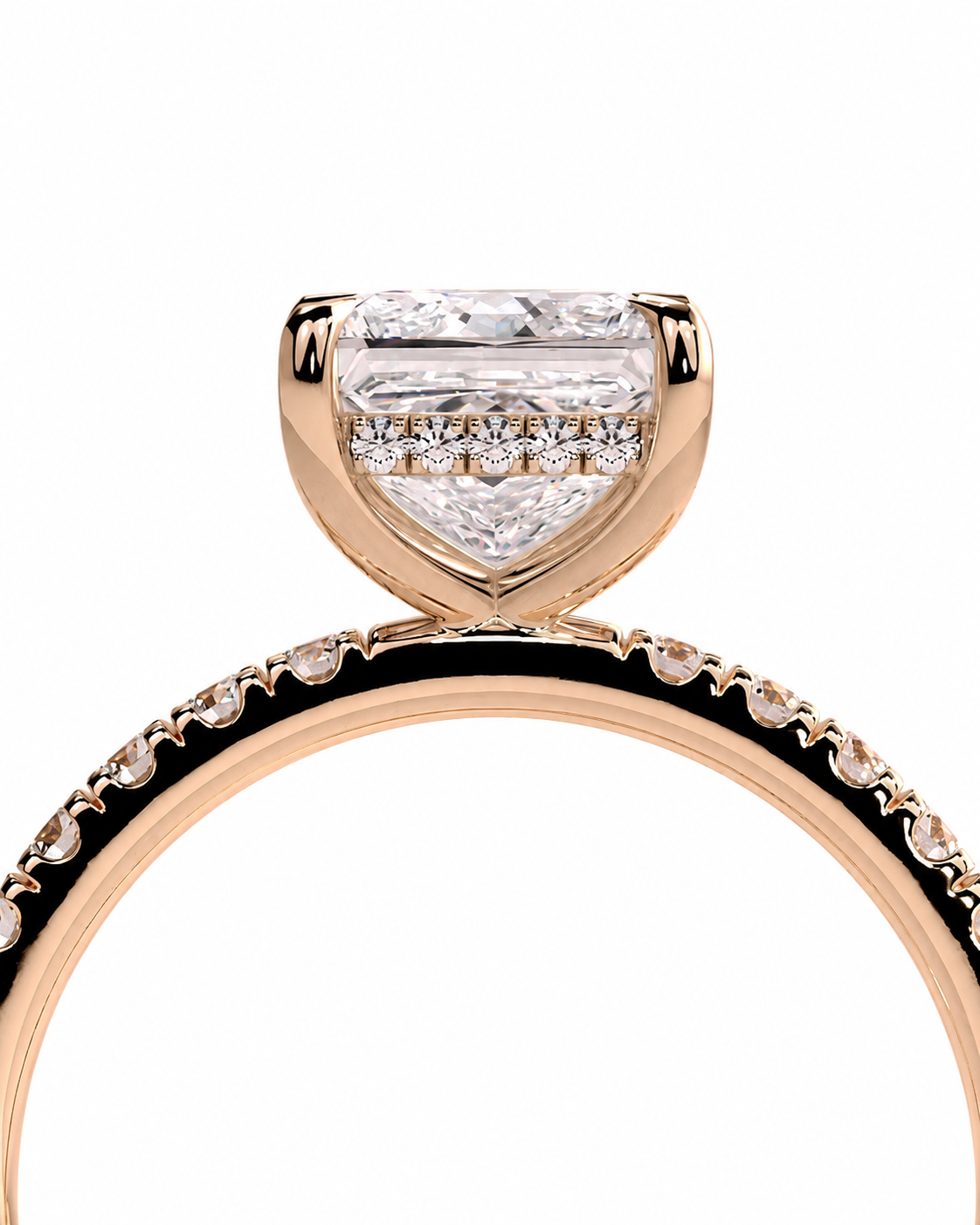 color_10K_RG, color_14K_RG &&A close-up of a rose gold engagement ring featuring a large shield-shaped clear center stone and a pave band with small accent stones, set against a plain white background.