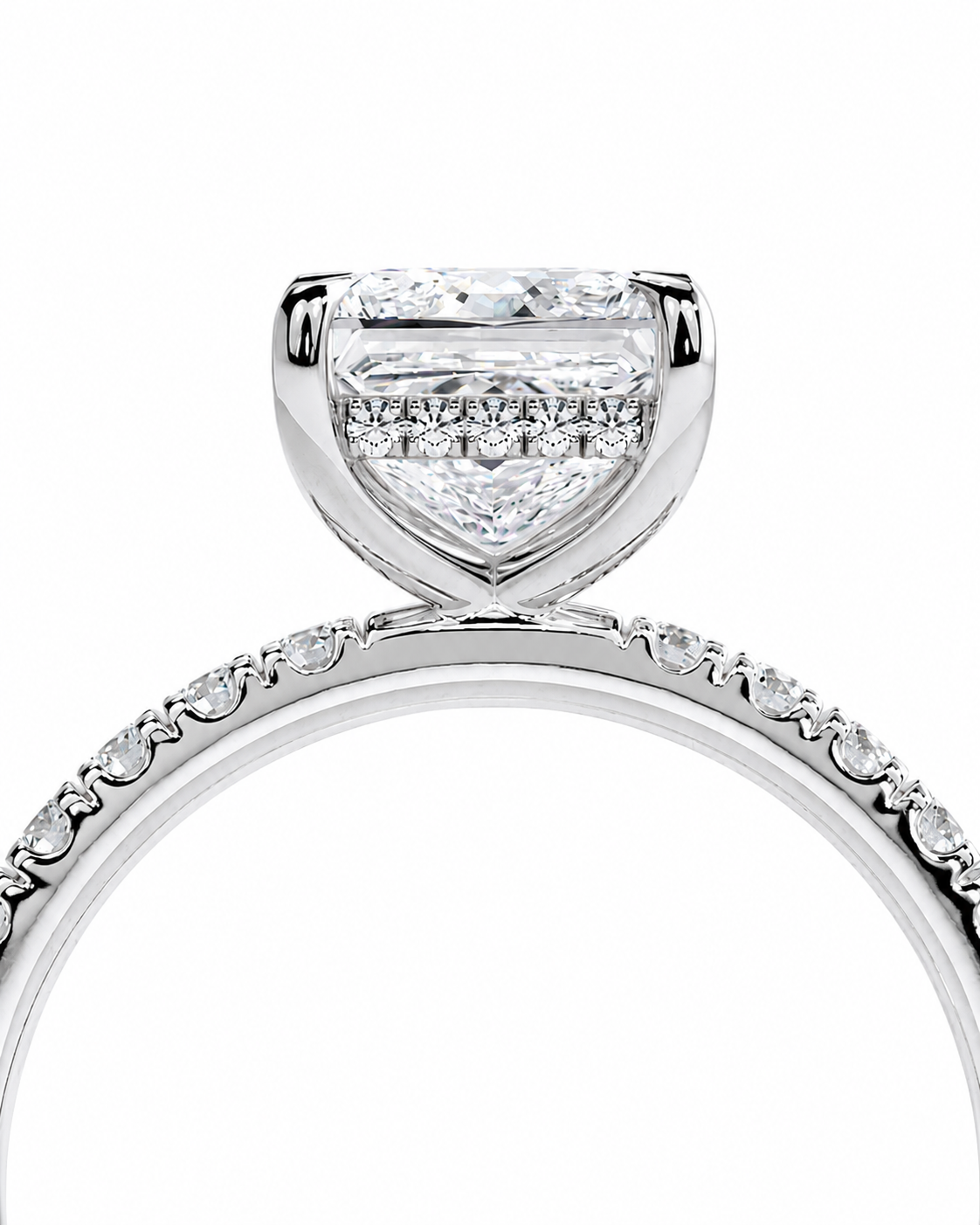 color_925_SIL,color_935_ARG,color_10K_WG, color_14K_WG &&A close-up studio shot of a silver-toned diamond ring featuring a heart-shaped diamond center stone in a prong setting, with a pave band accented by small round diamonds, on a white background.