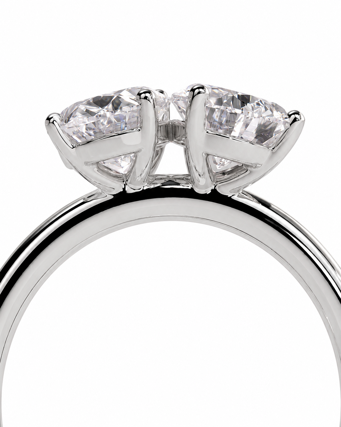 color_925_SIL,color_935_ARG,color_10K_WG, color_14K_WG &&A close-up studio shot of a silver-toned ring with two large clear marquise-cut gemstones in a four-prong setting, shown against a plain white background.