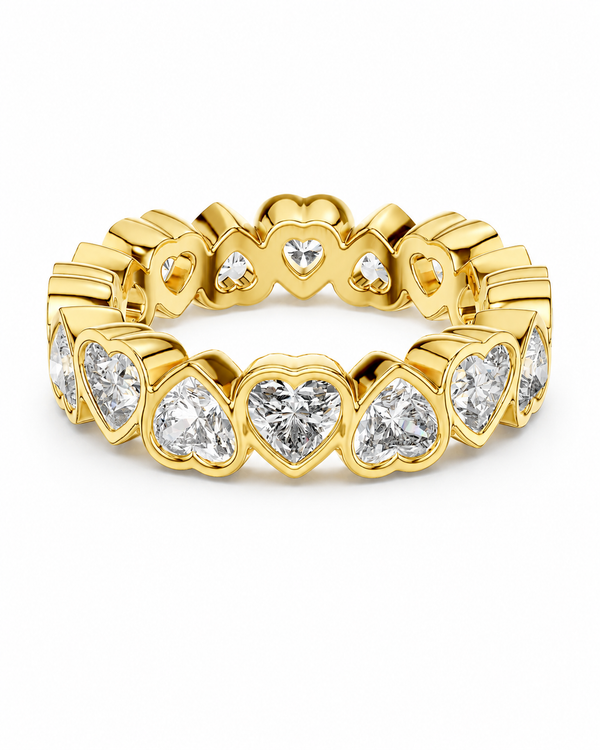 color_10K_YG, color_14K_YG &&	
A yellow gold eternity-style ring featuring a continuous row of heart-shaped clear gemstones, photographed on a clean white background.