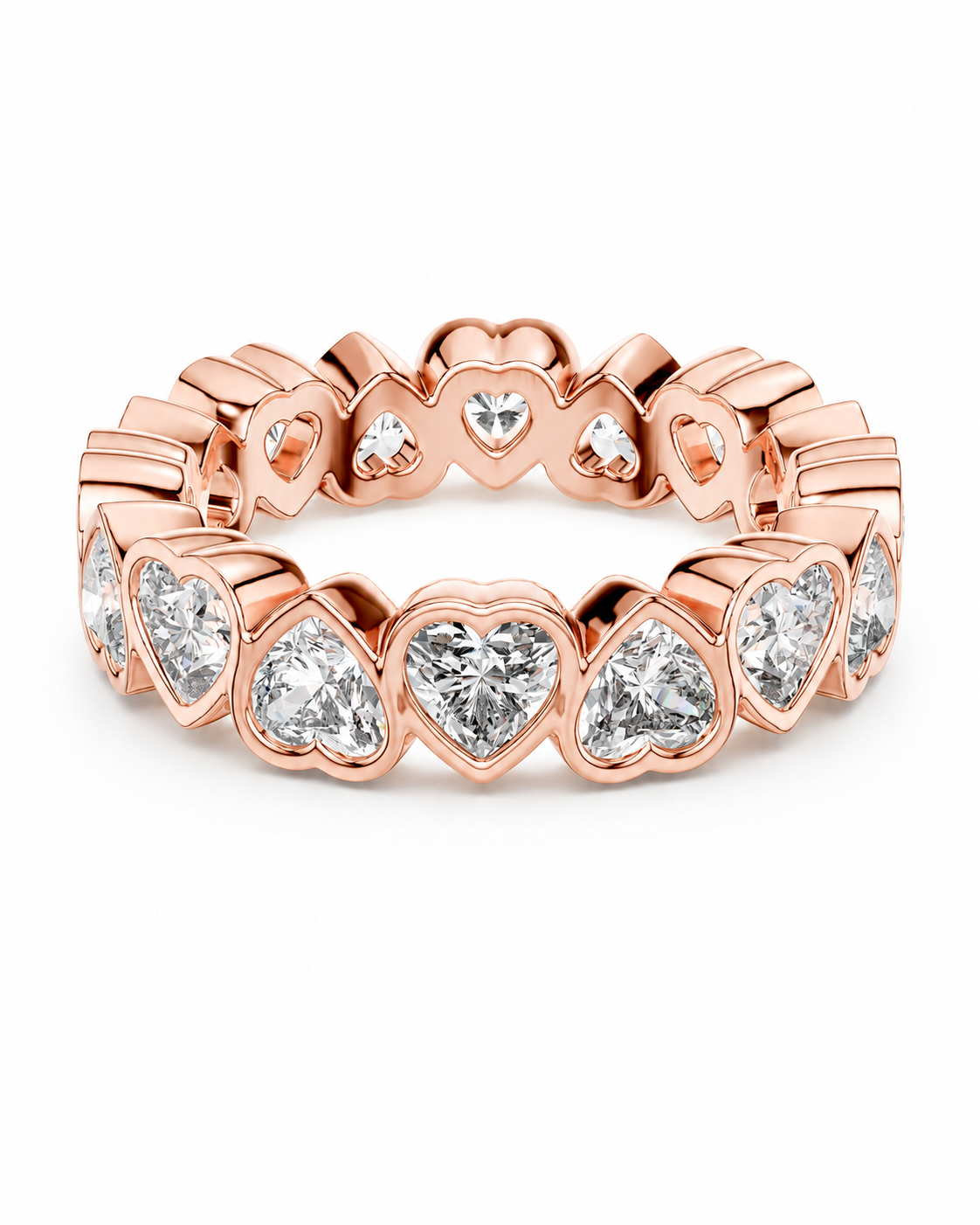 color_10K_RG, color_14K_RG &&	A rose gold eternity band ring featuring a continuous row of heart-shaped bezel settings holding clear heart-cut gemstones, shown on a clean white background.