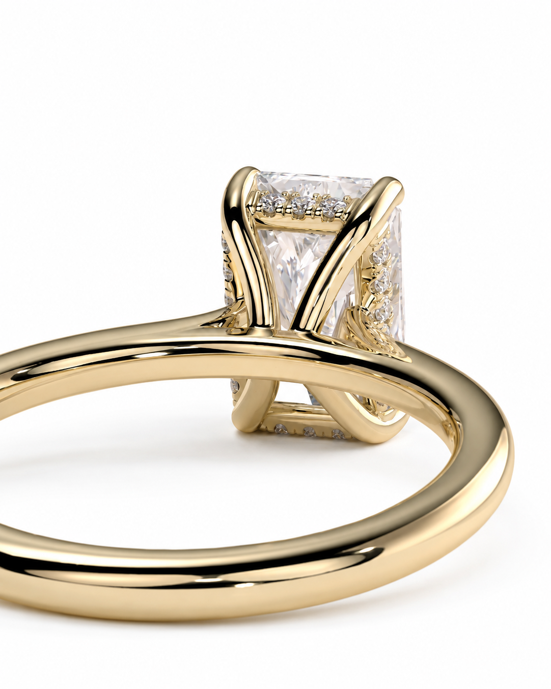 color_10K_YG, color_14K_YG &&A close-up shot of a yellow gold ring featuring a rectangular clear gemstone in a prong setting with small accent diamonds, shown on a clean white background.