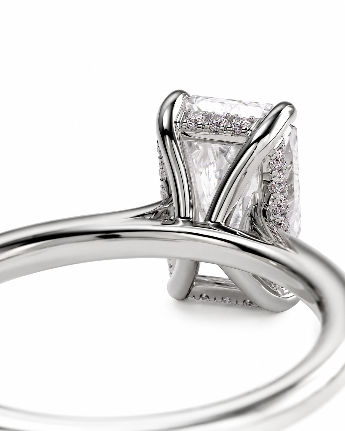 color_925_SIL,color_935_ARG,color_10K_WG, color_14K_WG &&A close-up studio shot of a silver-toned ring featuring a rectangular clear gemstone in a prong setting with small accent stones along the sides, shown against a plain white background.