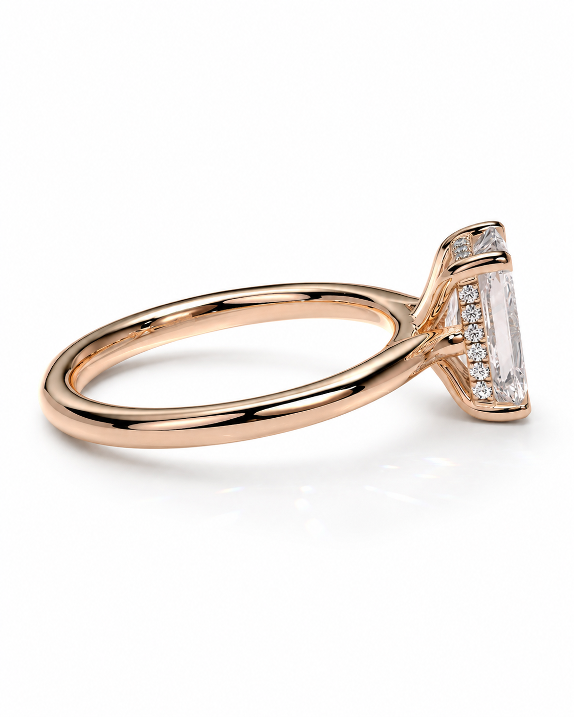 color_10K_RG, color_14K_RG &&A rose gold engagement ring featuring a large rectangular emerald-cut center stone accented by small round diamonds along the side, set against a clean white background.