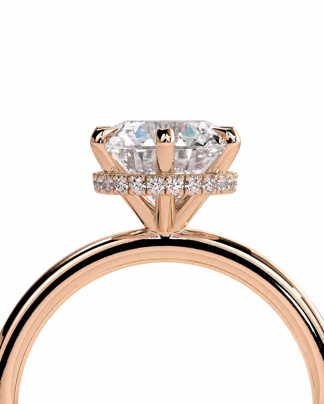 color_10K_RG, color_14K_RG &&Rose gold engagement ring featuring a cushion-cut diamond center stone and a halo of small round diamonds, shown against a solid white background.