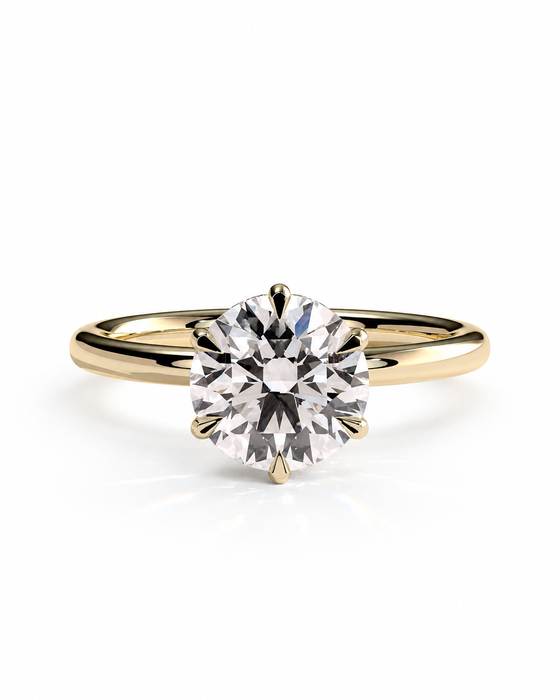 color_10K_YG, color_14K_YG &&A classic solitaire engagement ring featuring a round brilliant-cut diamond set in a yellow gold four-prong setting, on a polished yellow gold band, shot against a seamless white background.