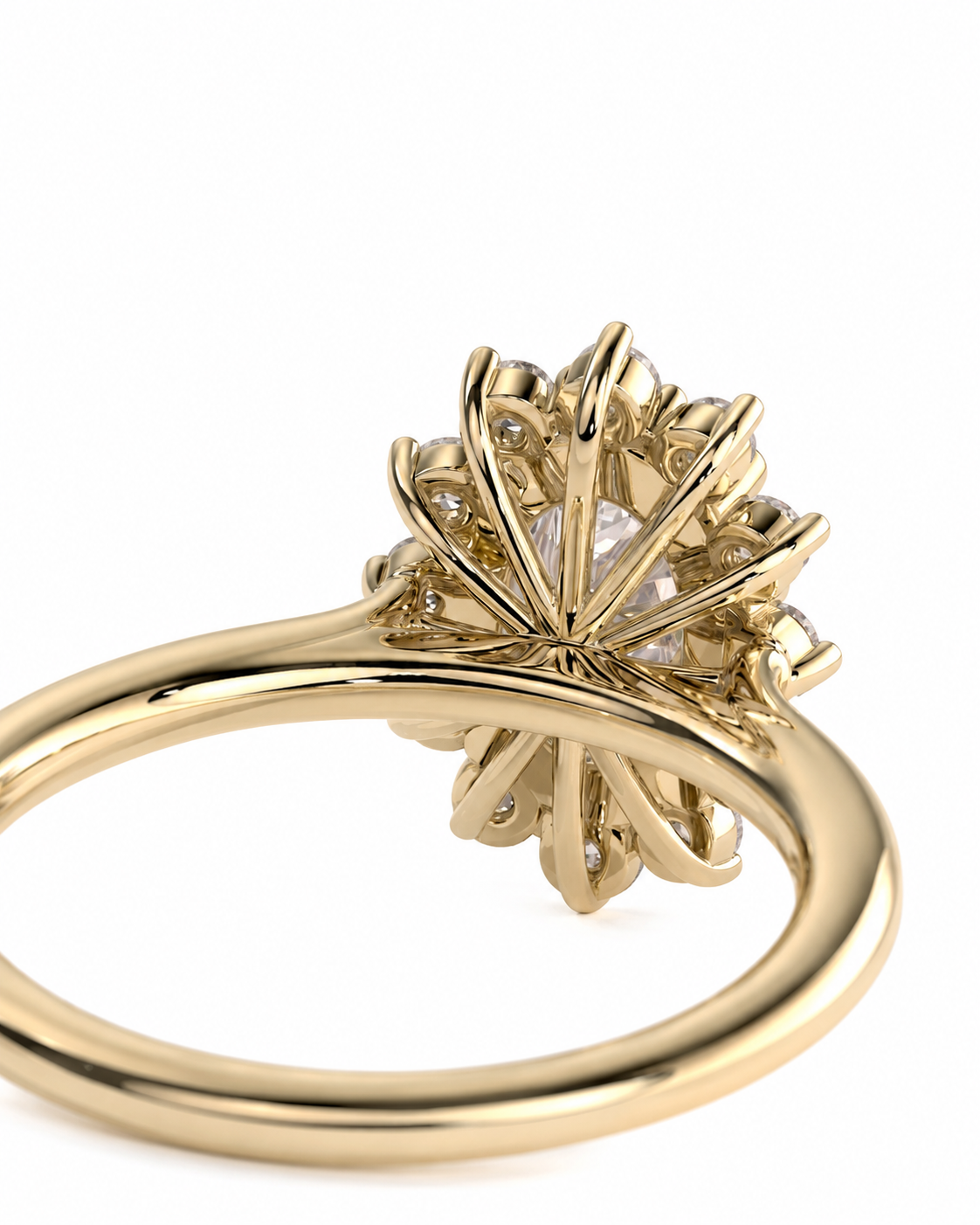 color_10K_YG, color_14K_YG &&A close-up shot of a yellow gold ring featuring a unique, sculptural sunburst or flower-like setting with a clear central gemstone, set against a plain white background.