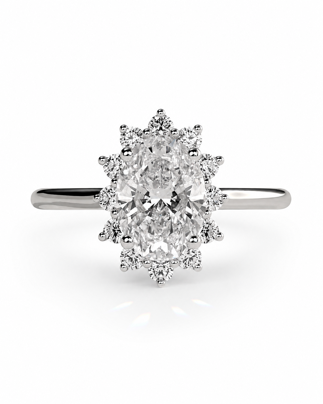 color_925_SIL,color_935_ARG,color_10K_WG, color_14K_WG &&An oval-cut diamond ring with a halo setting in silver-colored metal, shown on a clean white background.