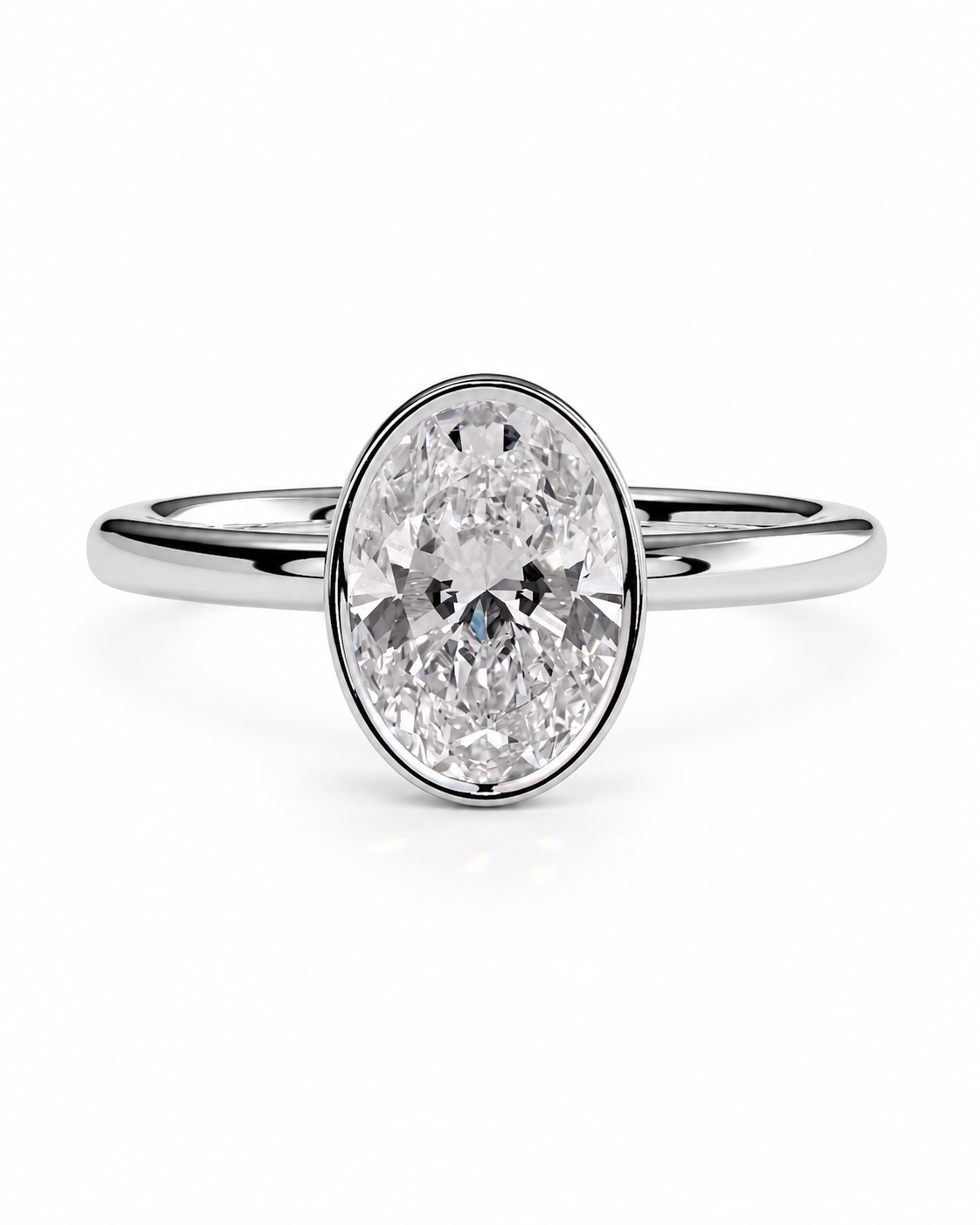 color_925_SIL,color_935_ARG,color_10K_WG, color_14K_WG &&An oval-cut diamond engagement ring with a polished silver-colored band, shown on a clean white background.