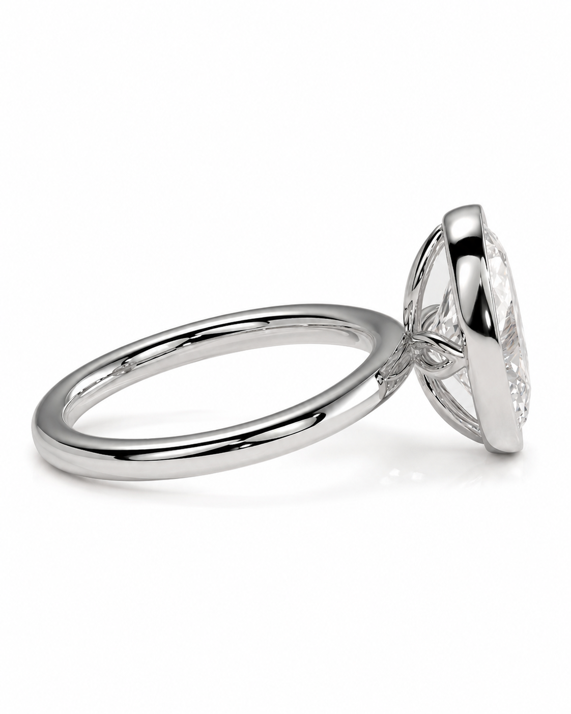 color_925_SIL,color_935_ARG,color_10K_WG, color_14K_WG &&A silver-toned diamond ring with a bezel-set round diamond, shown in a side profile view on a clean white background.