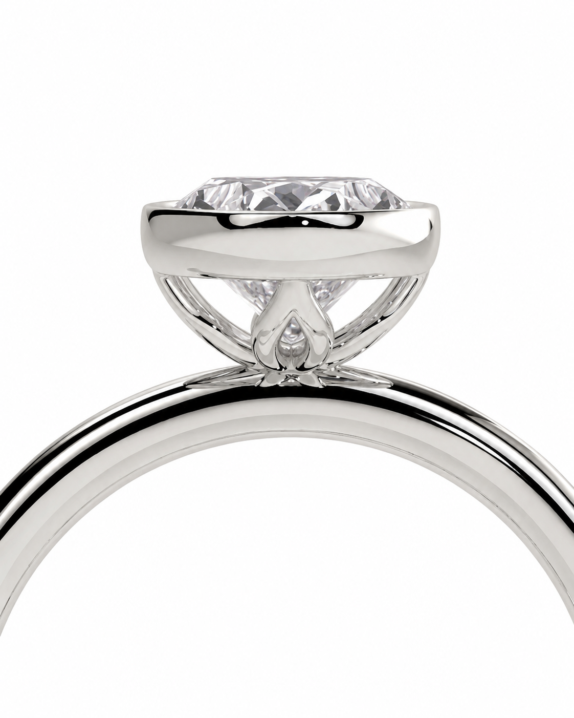 color_925_SIL,color_935_ARG,color_10K_WG, color_14K_WG &&Close-up of a silver-toned solitaire engagement ring with a round brilliant-cut diamond in a high-profile bezel setting, shown on a plain white background.