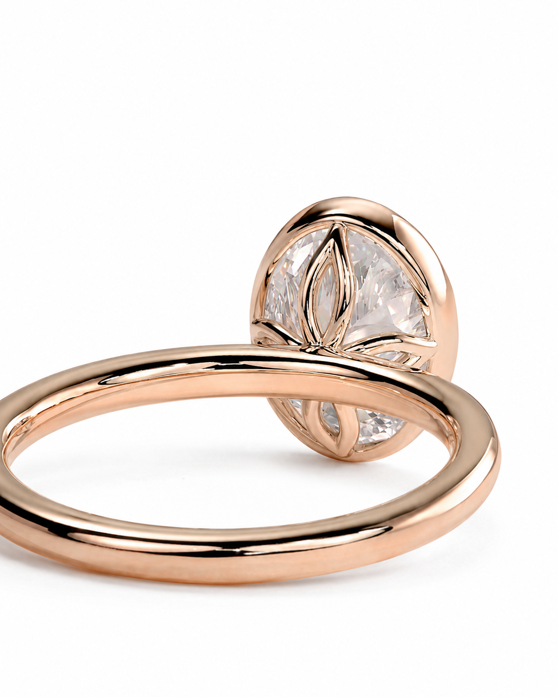 color_10K_RG, color_14K_RG &&A rose gold ring with a unique open band design and a large oval clear gemstone featuring a leaf-like floral pattern, shown on a clean white background.
