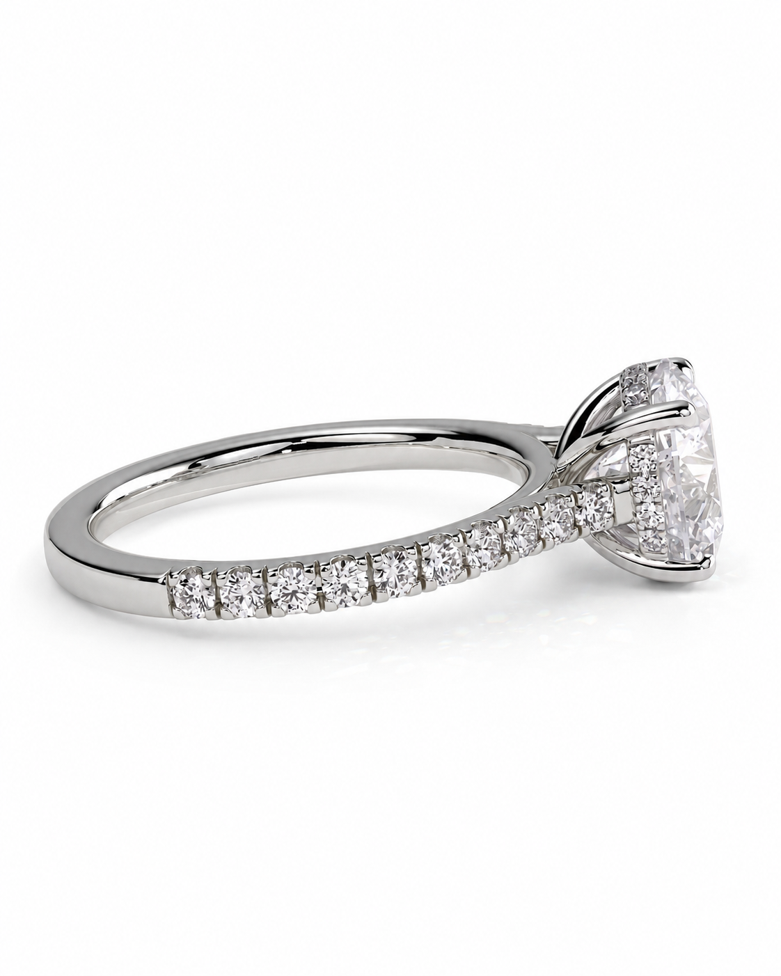 color_925_SIL,color_935_ARG,color_10K_WG, color_14K_WG &&A silver-toned diamond engagement ring featuring a large round-cut center stone and a pave band with smaller diamonds, shown on a clean white background.