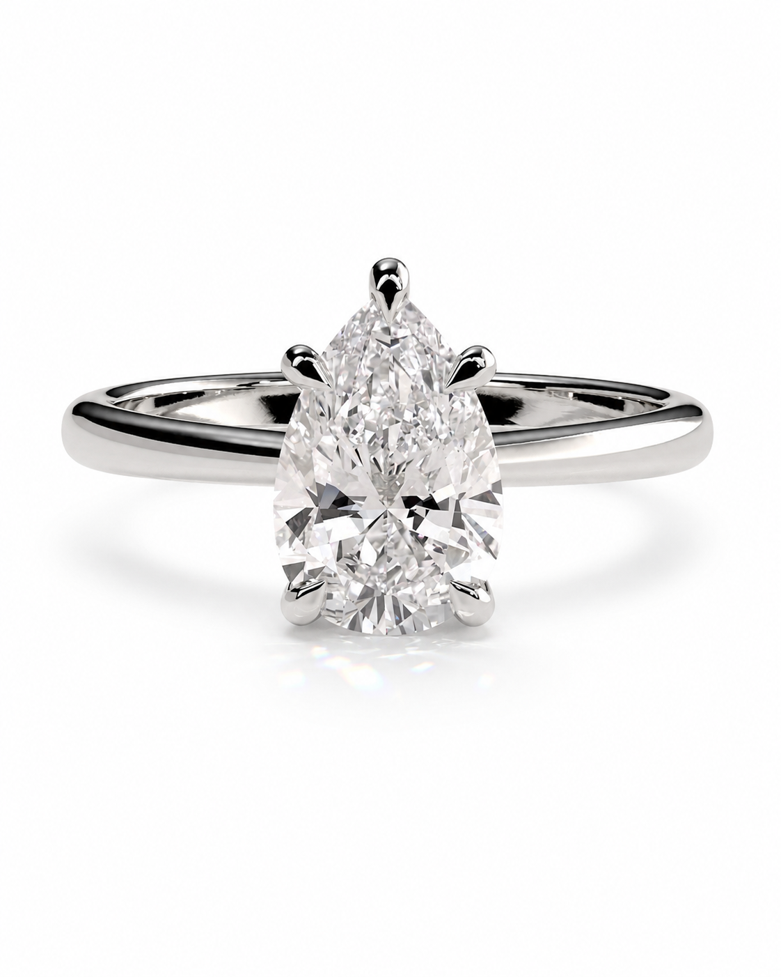 color_925_SIL,color_935_ARG,color_10K_WG, color_14K_WG &&A pear-cut diamond engagement ring in a polished silver-colored metal band, centered on a clean white background with a soft reflection.