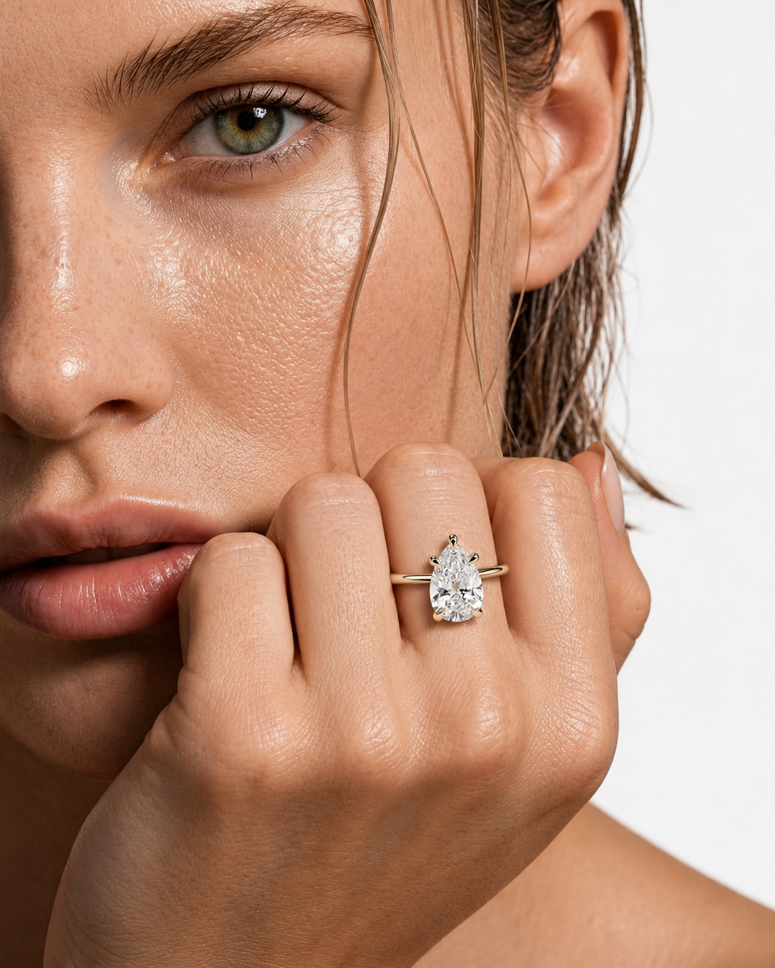 color_10K_YG, color_14K_YG &&Pear moissanite engagement ring with solitaire setting front view
