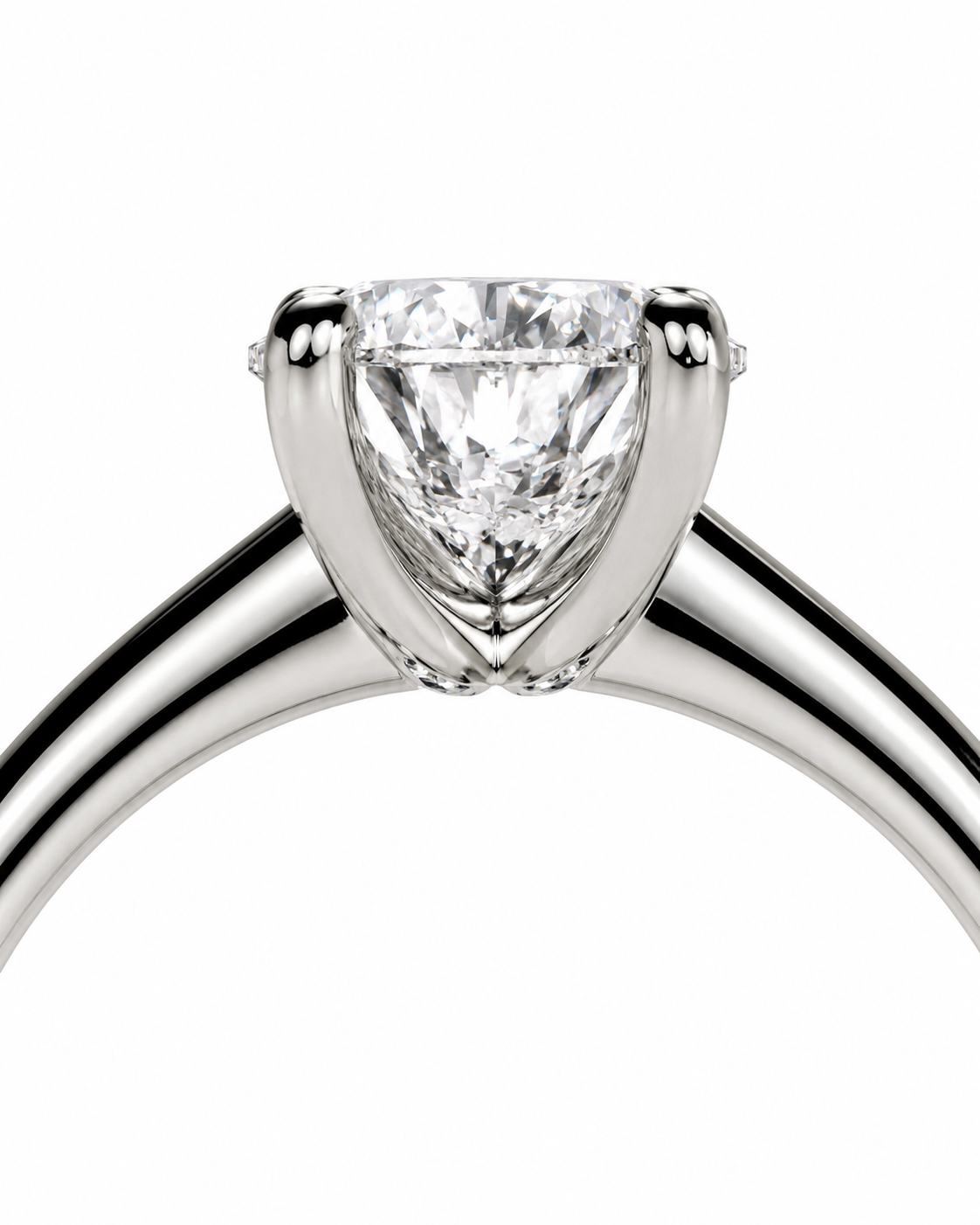 color_925_SIL,color_935_ARG,color_10K_WG, color_14K_WG &&A close-up studio shot of a classic solitaire engagement ring featuring a round brilliant-cut diamond set in a polished white gold or platinum band against a solid white background.