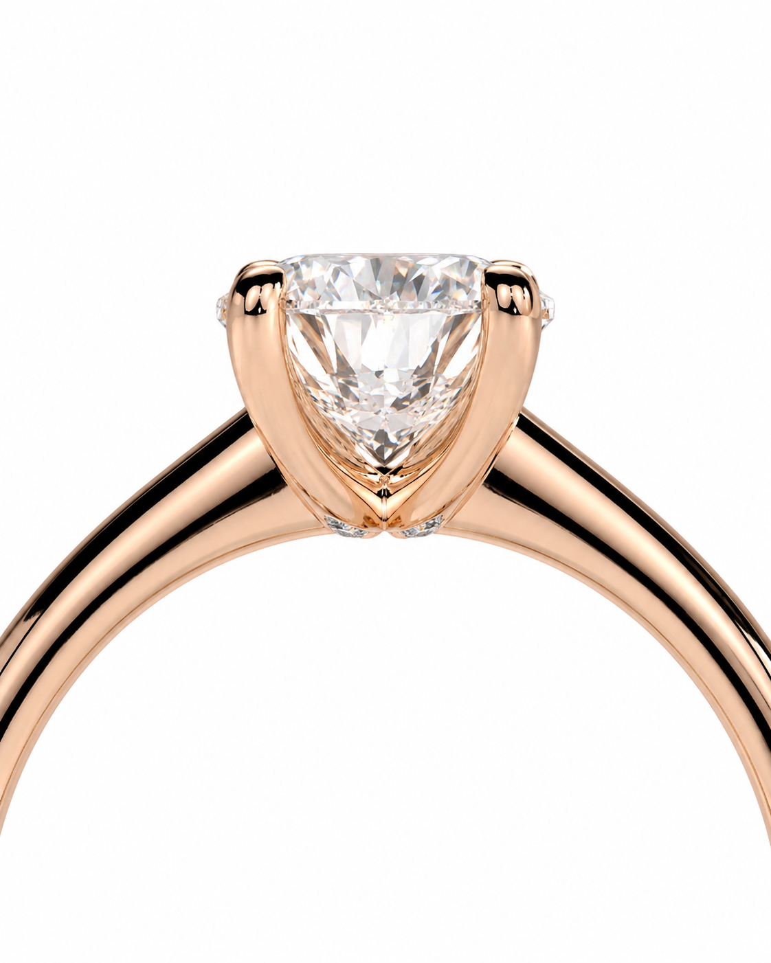 color_10K_RG, color_14K_RG &&A close-up of a rose gold solitaire engagement ring with a triangular-cut clear gemstone in a prong setting, shown against a plain white background.