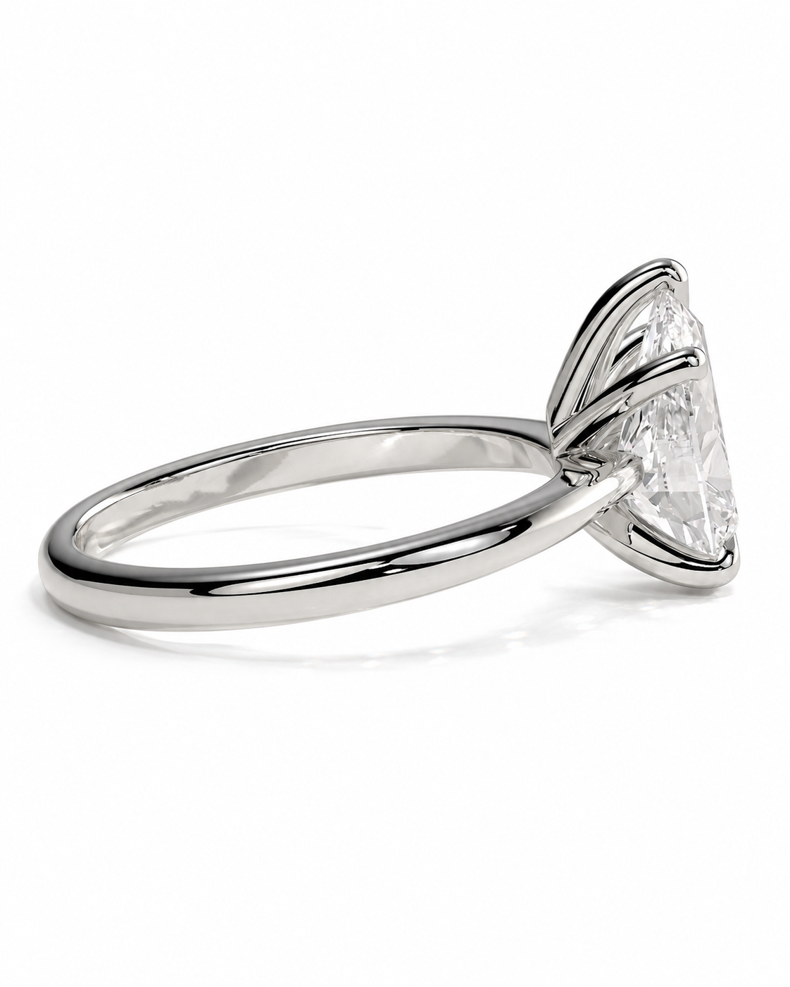 color_925_SIL,color_935_ARG,color_10K_WG, color_14K_WG &&A silver engagement ring featuring a large, triangular-cut clear gemstone in a prong setting, shown on a clean white background.