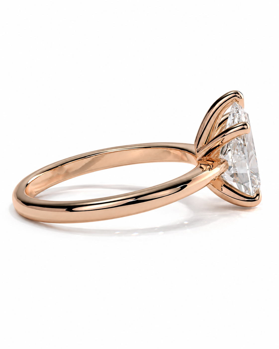 color_10K_RG, color_14K_RG &&A rose gold ring with a marquise-cut clear gemstone in a prong setting, shown on a clean white background.