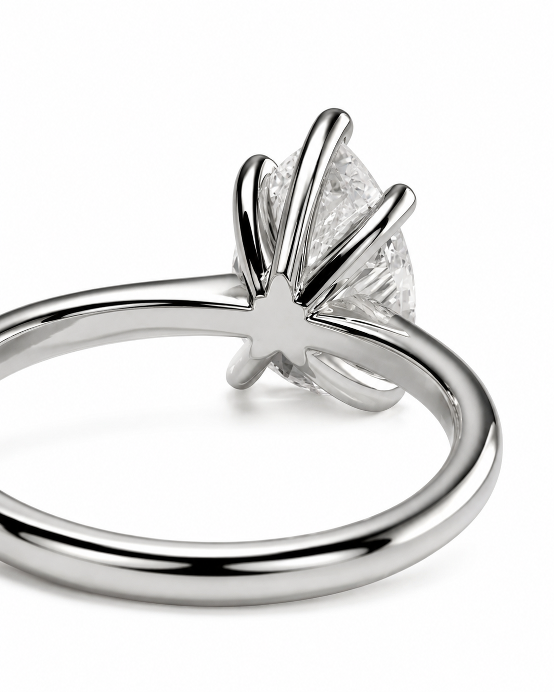 color_925_SIL,color_935_ARG,color_10K_WG, color_14K_WG &&A close-up studio shot of a silver-toned ring with a clear marquise-cut gemstone in a prong setting, shown against a plain white background.