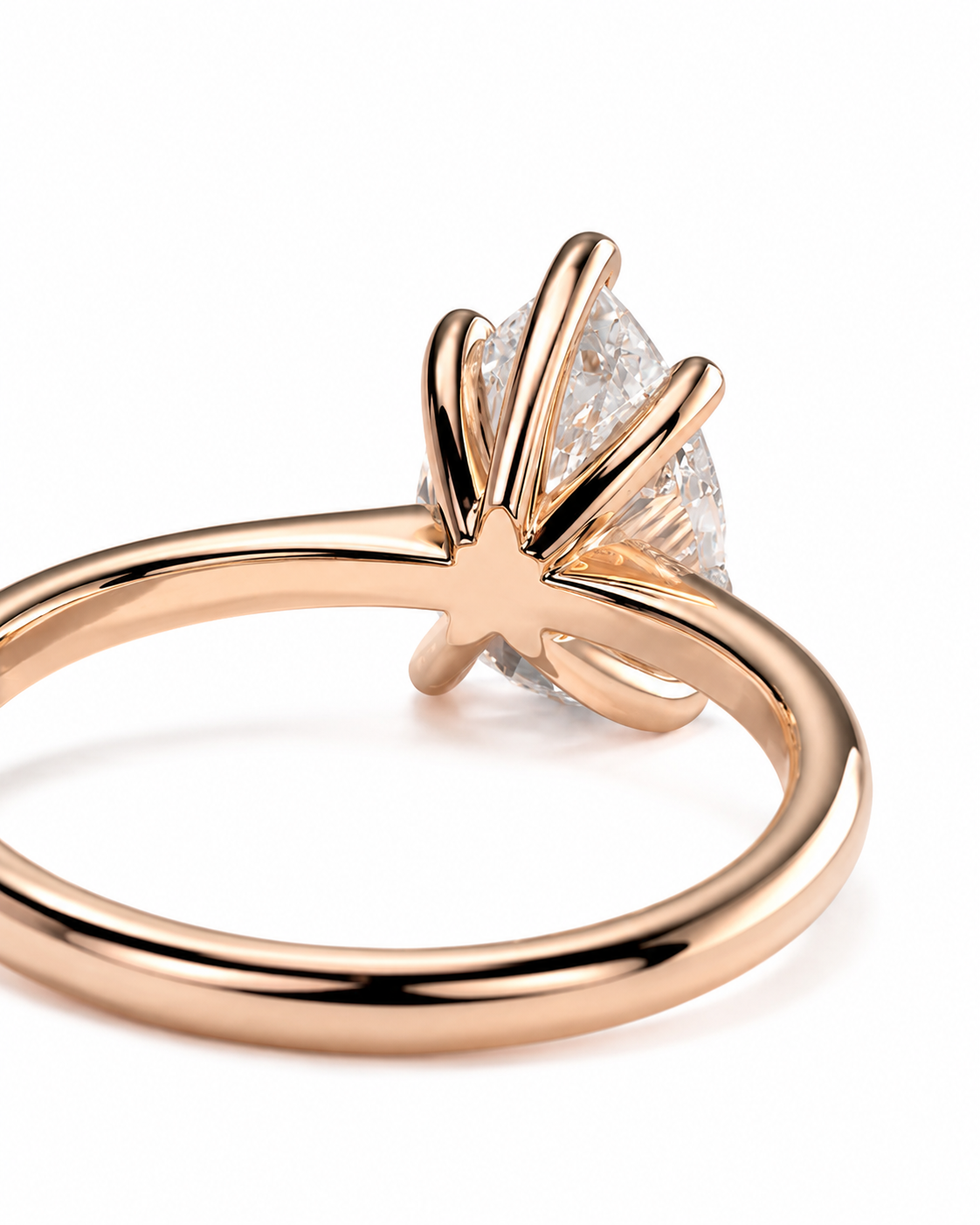 color_10K_RG, color_14K_RG &&A close-up shot of a rose gold ring with a marquise-cut diamond in a radiant cluster setting, shown on a clean white background.