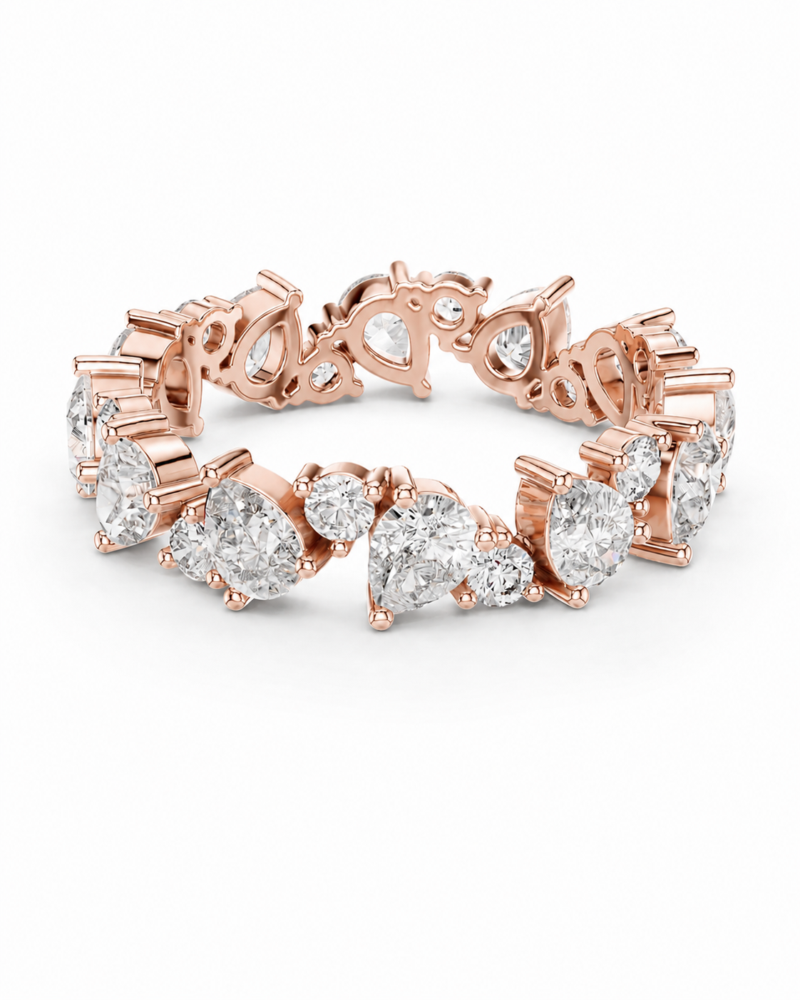 color_10K_RG, color_14K_RG &&	A rose gold eternity-style ring featuring a continuous line of round and pear-cut clear gemstones in prong settings, photographed on a clean white background.