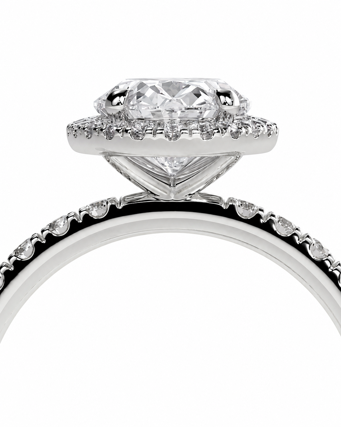 color_925_SIL,color_935_ARG,color_10K_WG, color_14K_WG &&A close-up studio shot of a silver-toned halo ring with a large round-cut center stone and small accent stones along the band, set against a plain white background.