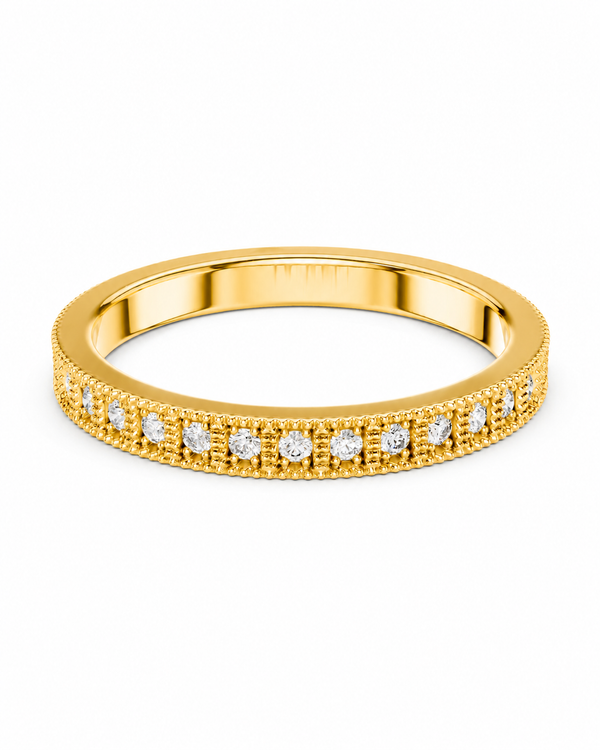 color_10K_YG, color_14K_YG &&	
A yellow gold eternity ring featuring a row of round-cut clear gemstones in a beaded channel setting, shown on a plain white background.