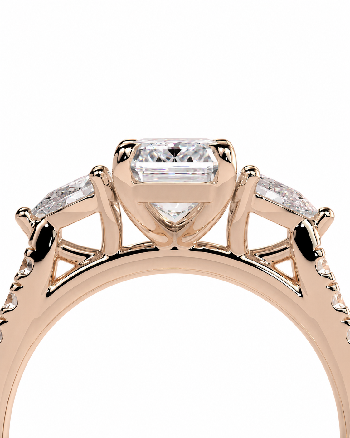 color_10K_RG, color_14K_RG &&Rose gold ring with a central princess-cut diamond and two marquise-cut diamonds on the shoulders, shown against a plain white background.