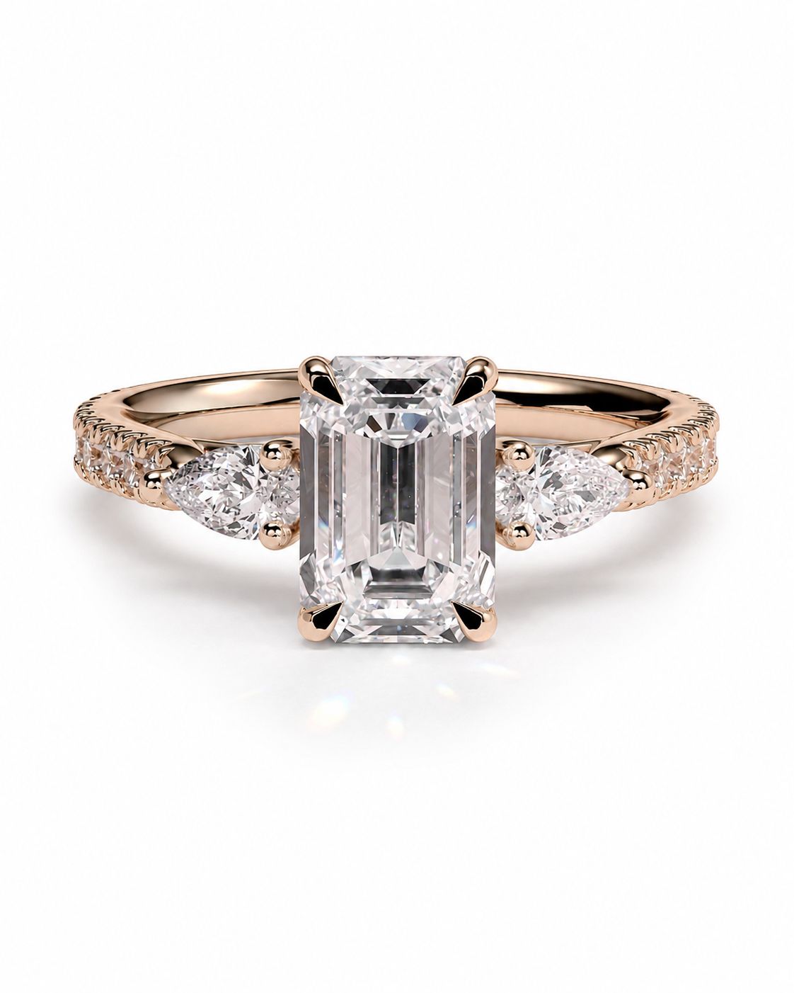 color_10K_RG, color_14K_RG &&A rose gold engagement ring featuring a large emerald-cut center diamond flanked by round and marquise side diamonds on a clean white background.