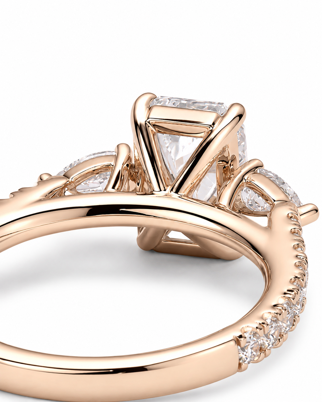 color_10K_RG, color_14K_RG &&Rose gold ring with a triangular clear gemstone and small accent stones on a white background.