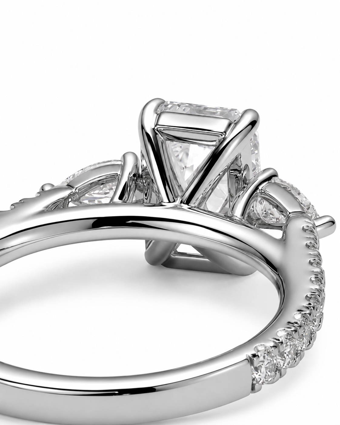 color_925_SIL,color_935_ARG,color_10K_WG, color_14K_WG &&A close-up studio shot of a silver-toned diamond ring featuring a rectangular cushion-cut center stone and small pave-set diamonds along the band, set against a clean white background.