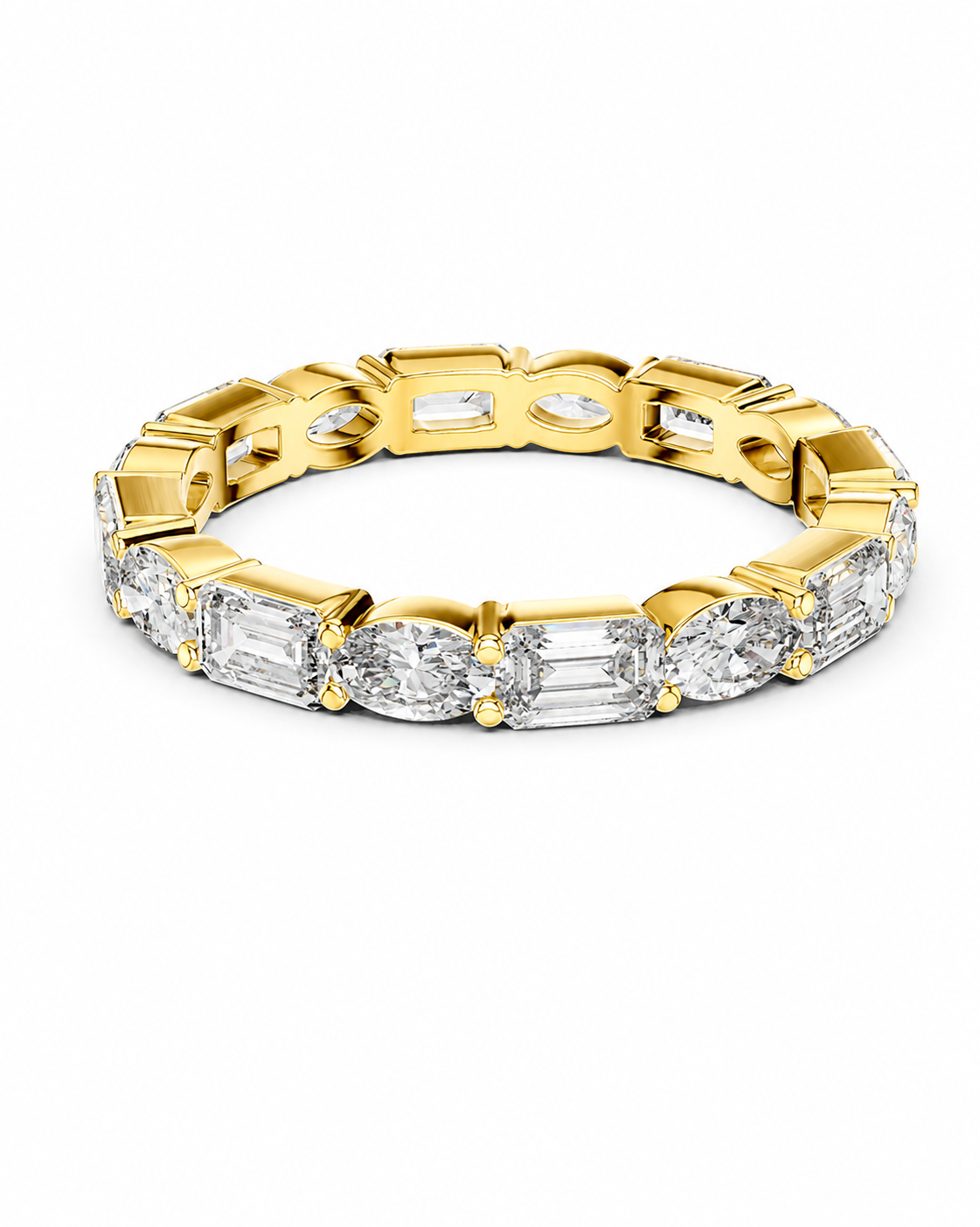 color_10K_YG, color_14K_YG &&	
A yellow gold eternity-style tennis bracelet featuring baguette and oval-cut clear stones, shown on a clean white background.