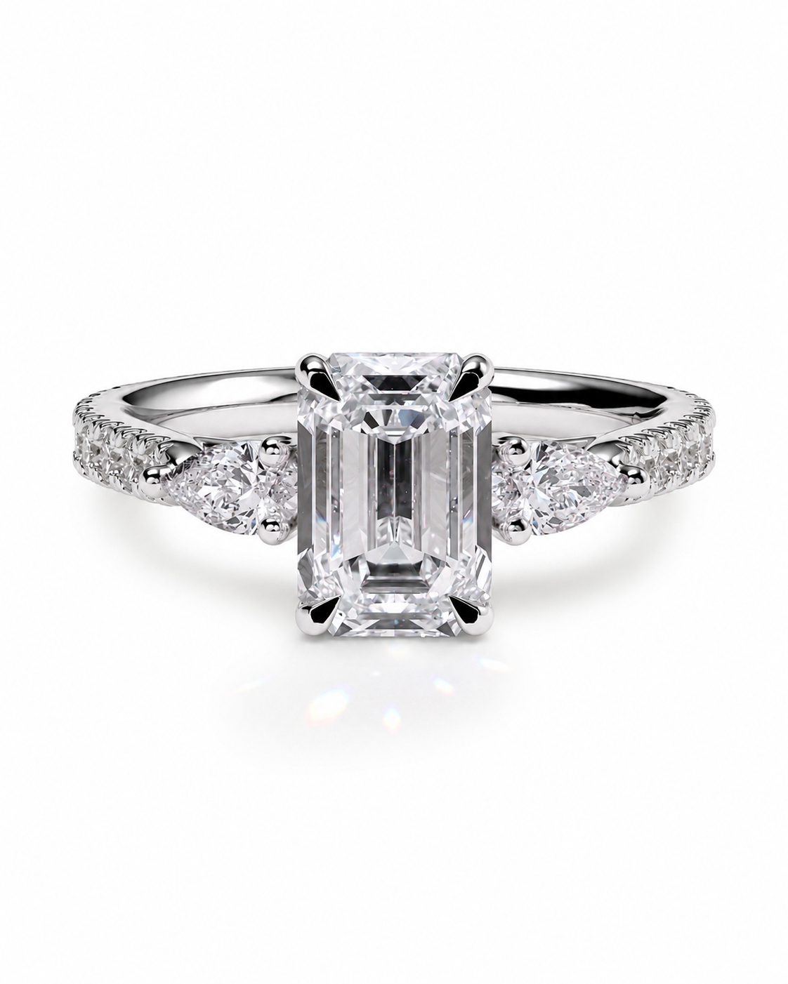 color_925_SIL,color_935_ARG,color_10K_WG, color_14K_WG &&An emerald-cut diamond engagement ring with a silver-colored band set with small accent diamonds, shown on a clean white background.