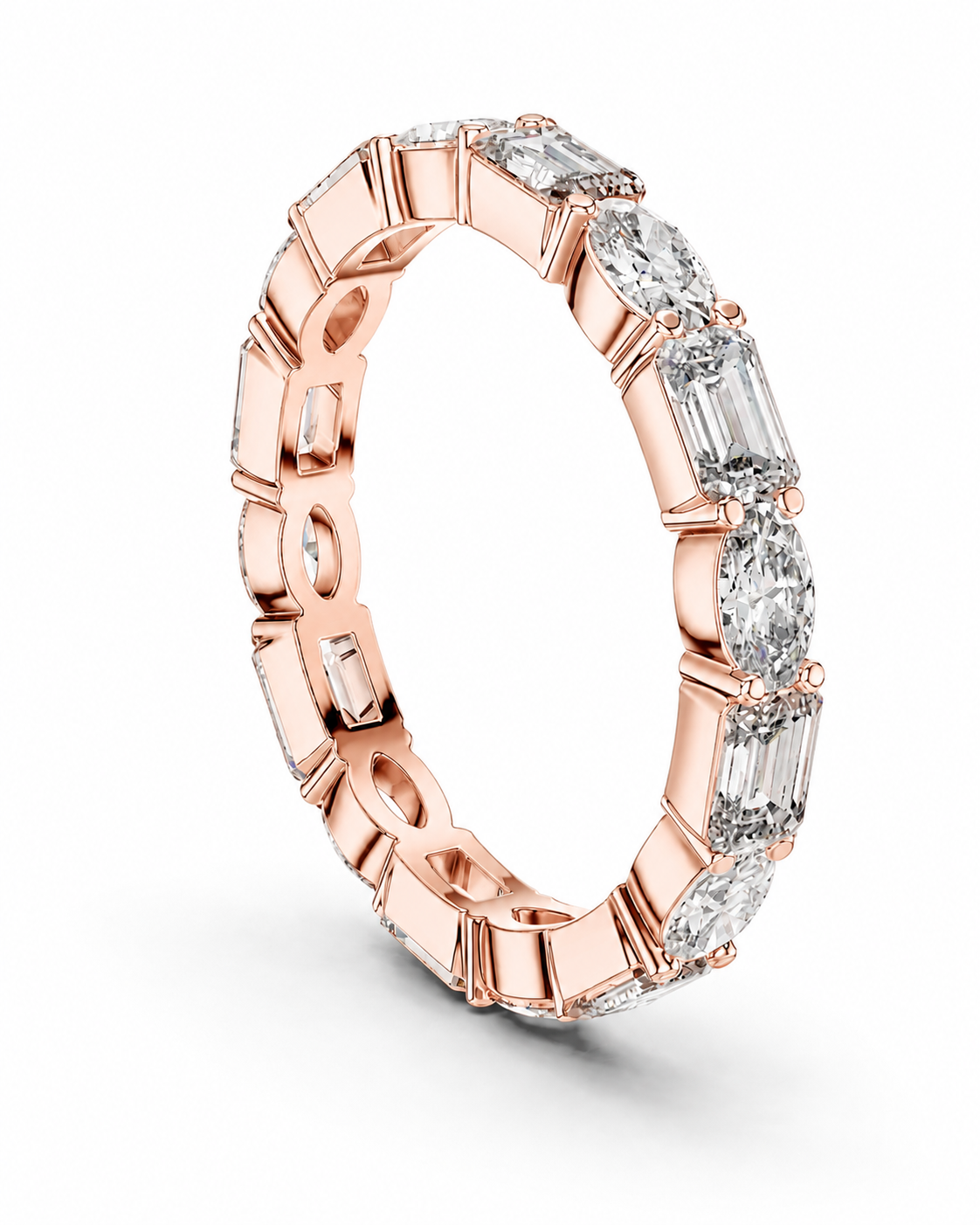 color_10K_RG, color_14K_RG &&	A rose gold eternity ring featuring a continuous line of baguette and round-cut clear gemstones in a prong setting, shown on a clean white background.