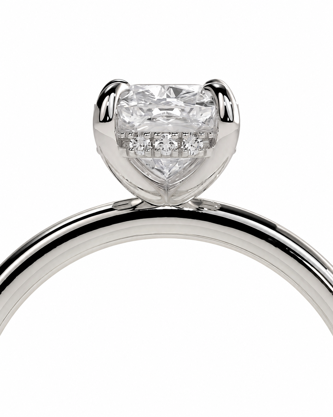 color_925_SIL,color_935_ARG,color_10K_WG, color_14K_WG &&A close-up studio shot of a silver-toned ring featuring a heart-shaped clear gemstone in a prong setting with small accent diamonds along the lower half of the stone, shown against a plain white background.