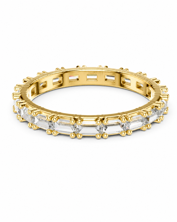 color_10K_YG, color_14K_YG &&	
A gold eternity-style ring with a continuous row of clear rectangular baguette-cut gemstones, shown on a plain white background.