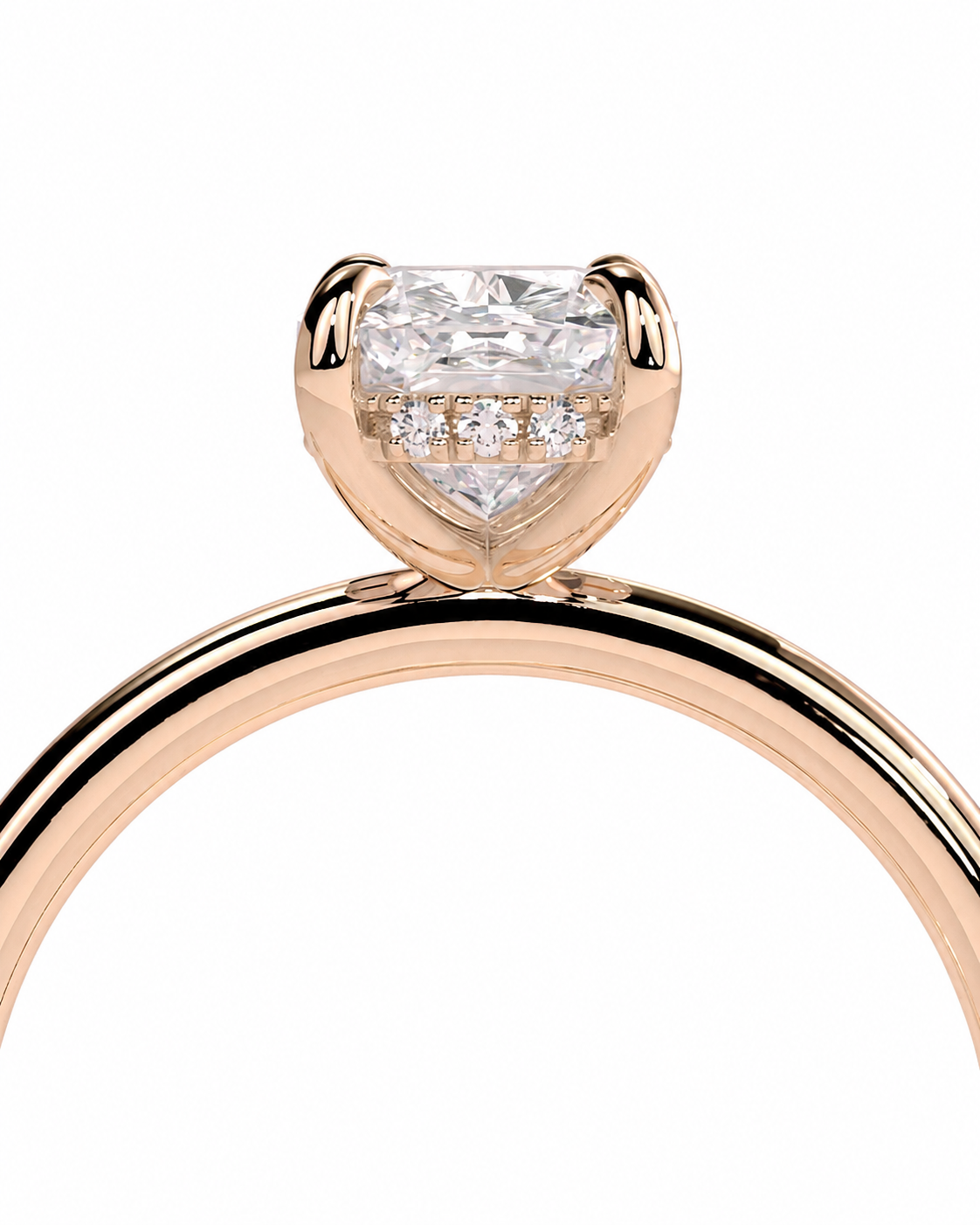 color_10K_RG, color_14K_RG &&Rose gold engagement ring featuring a cushion-cut diamond center stone with small accent diamonds, shown on a clean white background.