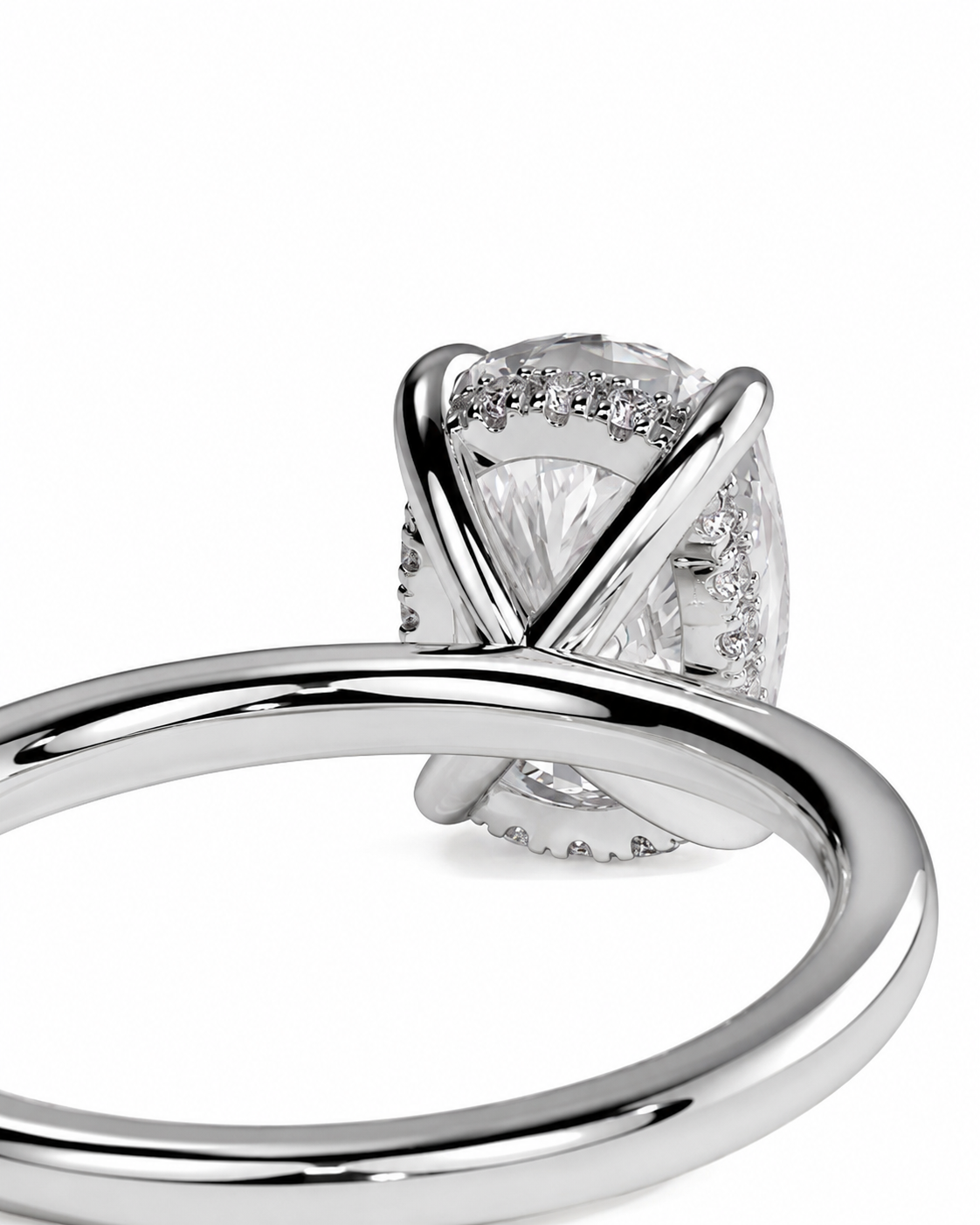 color_925_SIL,color_935_ARG,color_10K_WG, color_14K_WG &&A close-up of a silver-toned ring featuring a marquise-cut center stone and small pave-set accent stones, shown on a clean white background.
