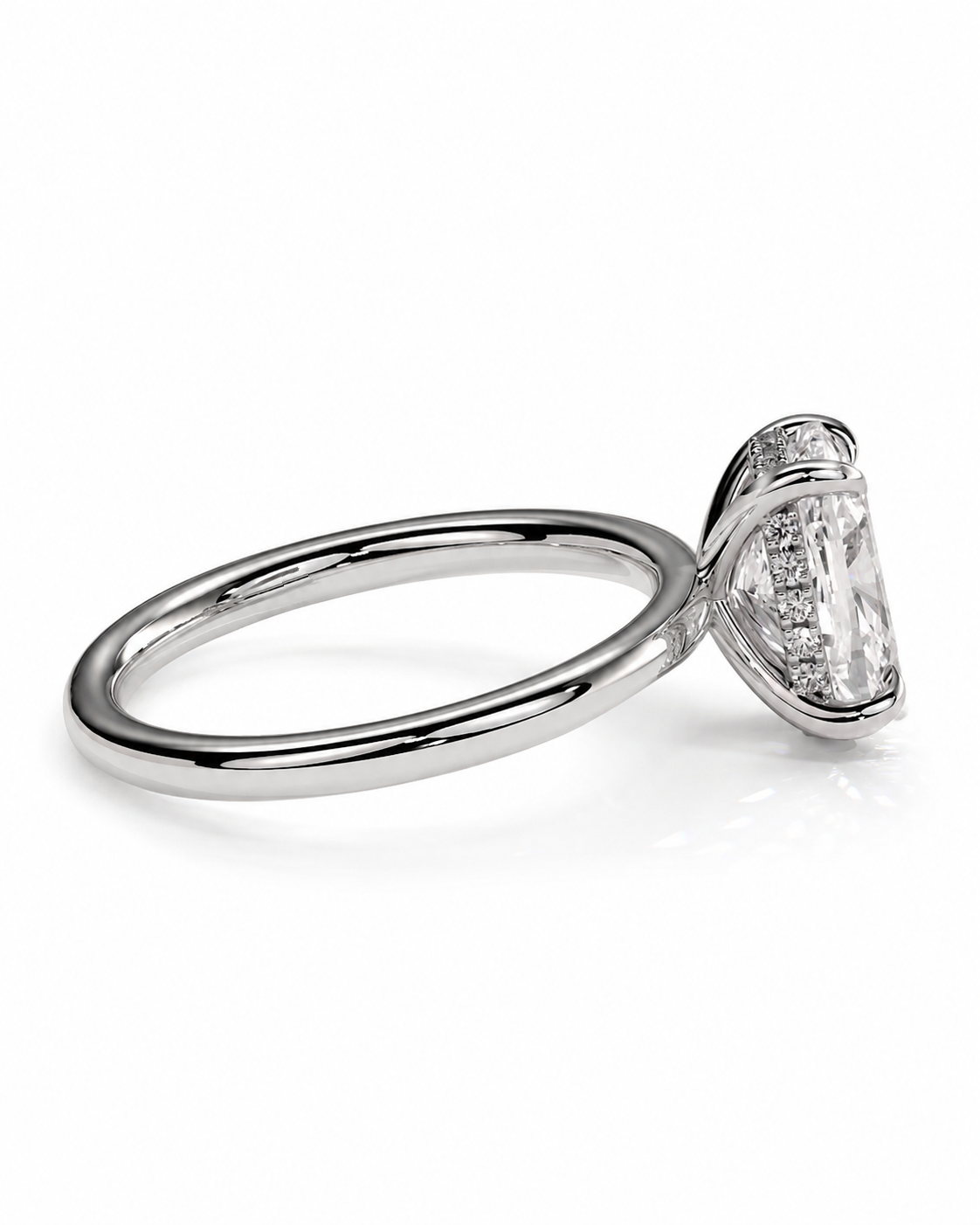 color_925_SIL,color_935_ARG,color_10K_WG, color_14K_WG &&A silver-toned solitaire engagement ring featuring a large oval-cut clear gemstone in a prong setting with a halo of smaller stones, shown on a clean white background.