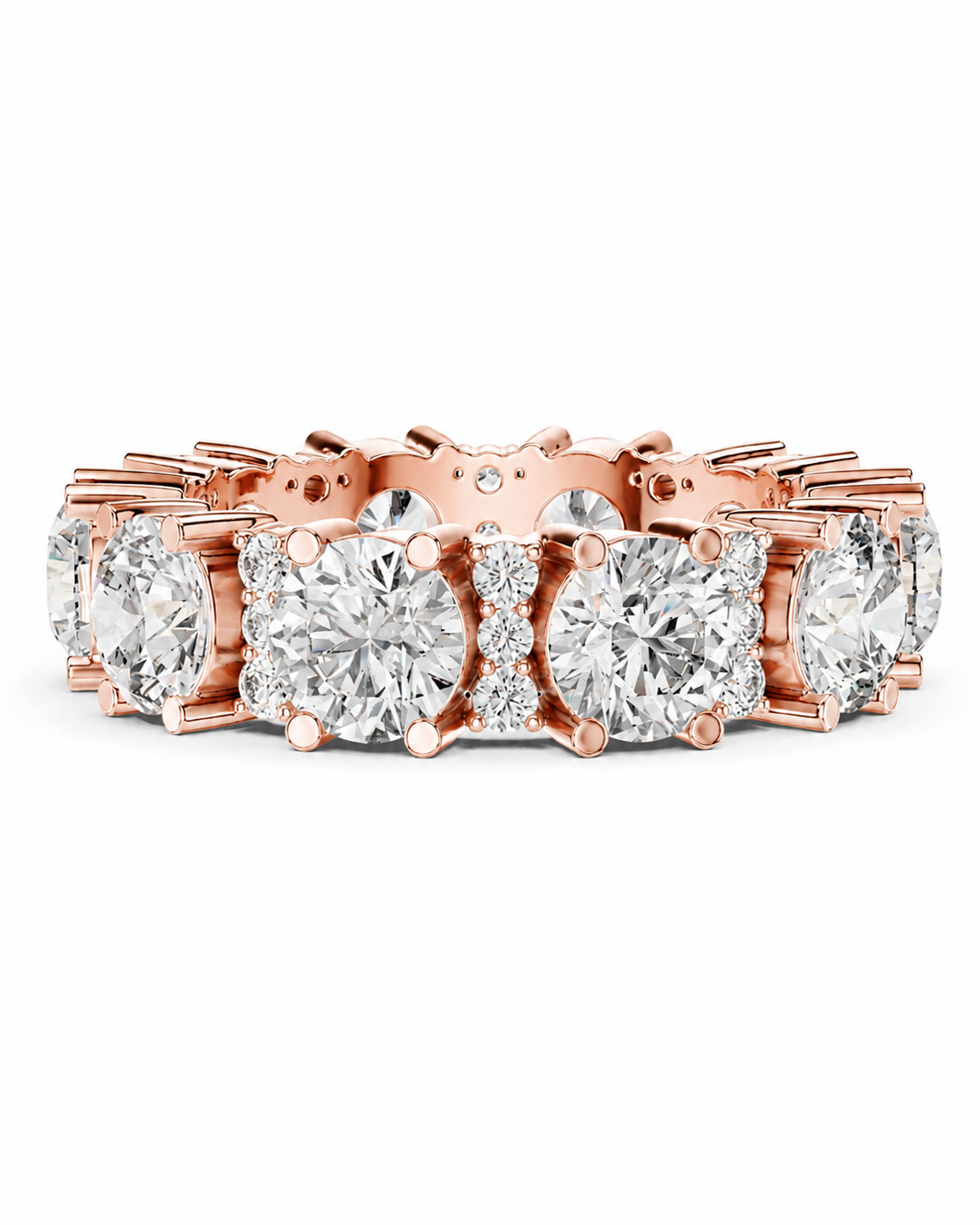 color_10K_RG, color_14K_RG &&	A rose gold eternity ring featuring a continuous line of round brilliant-cut diamonds and smaller accent diamonds, set in a polished rose gold band against a solid white background.