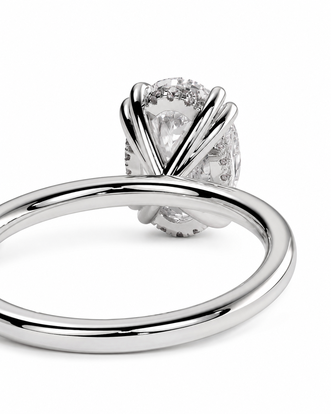 color_925_SIL,color_935_ARG,color_10K_WG, color_14K_WG &&A close-up studio shot of a silver-toned ring with a large clear central gemstone and smaller accent stones, shown on a plain white background.