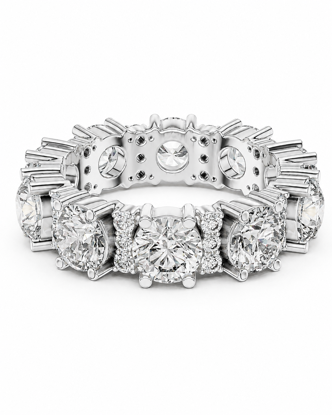 color_925_SIL,color_935_ARG,color_10K_WG, color_14K_WG &&	
A silver-toned diamond eternity ring with a central round diamond surrounded by smaller diamonds, flanked by a continuous line of round and baguette-cut diamonds on a white background.