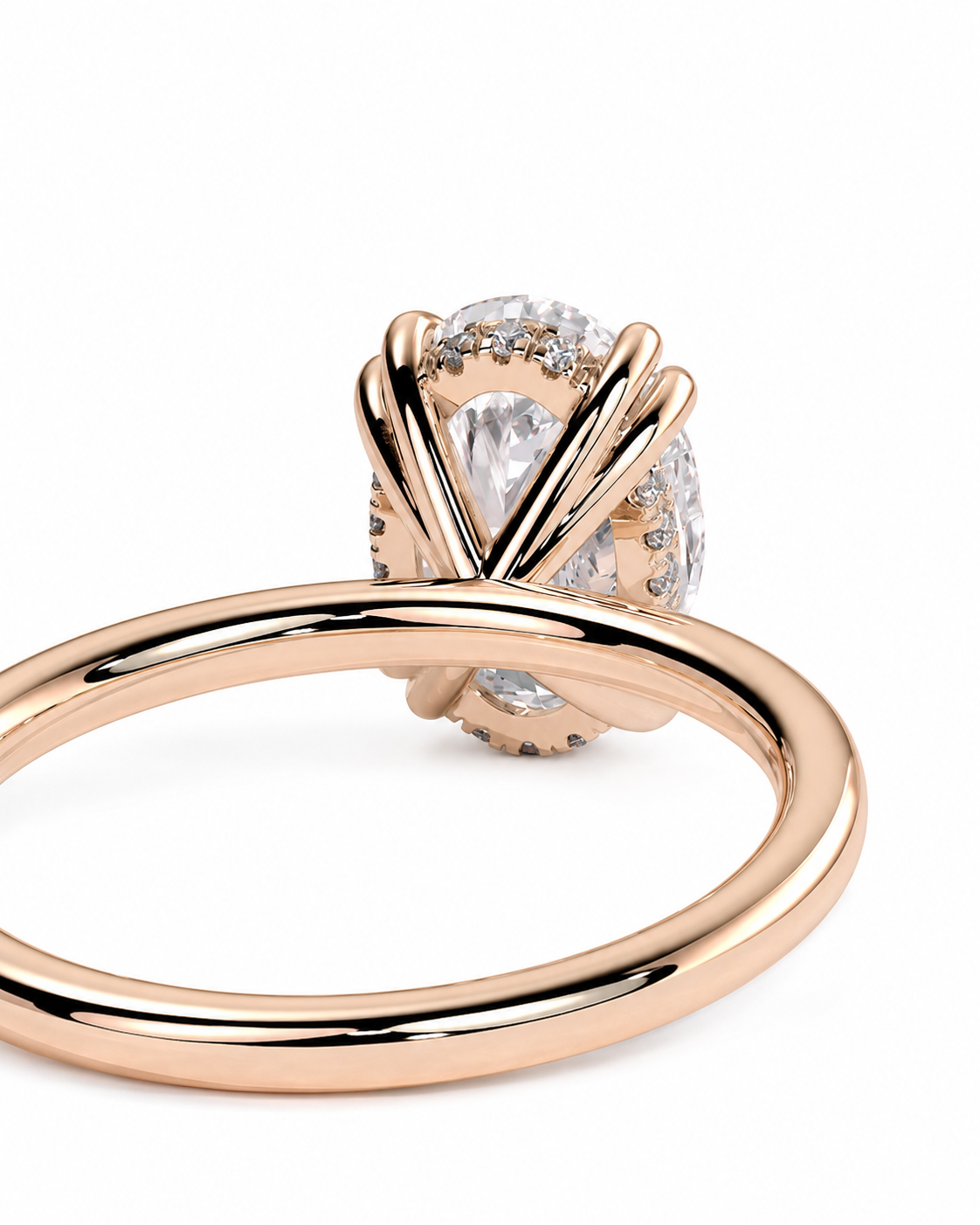 color_10K_RG, color_14K_RG &&Rose gold ring with a large pear-cut center stone and small accent stones, shown on a clean white background.