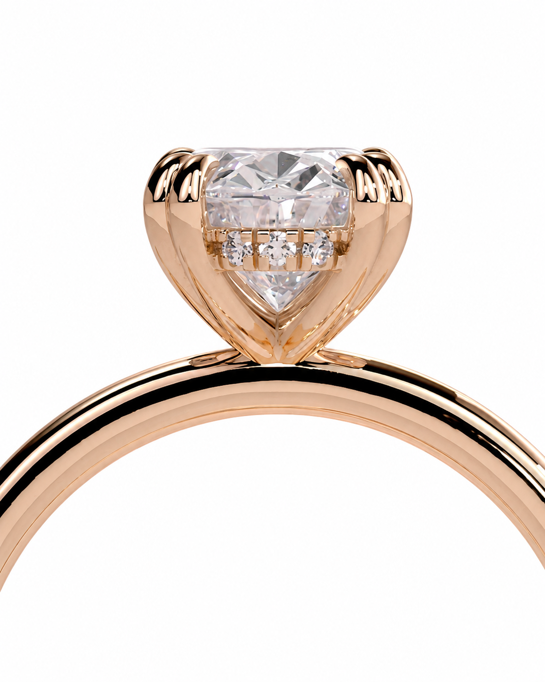 color_10K_RG, color_14K_RG &&A close-up of a rose gold ring featuring a heart-shaped clear gemstone in a heart-shaped prong setting, with small accent diamonds along the band, shown on a white background.