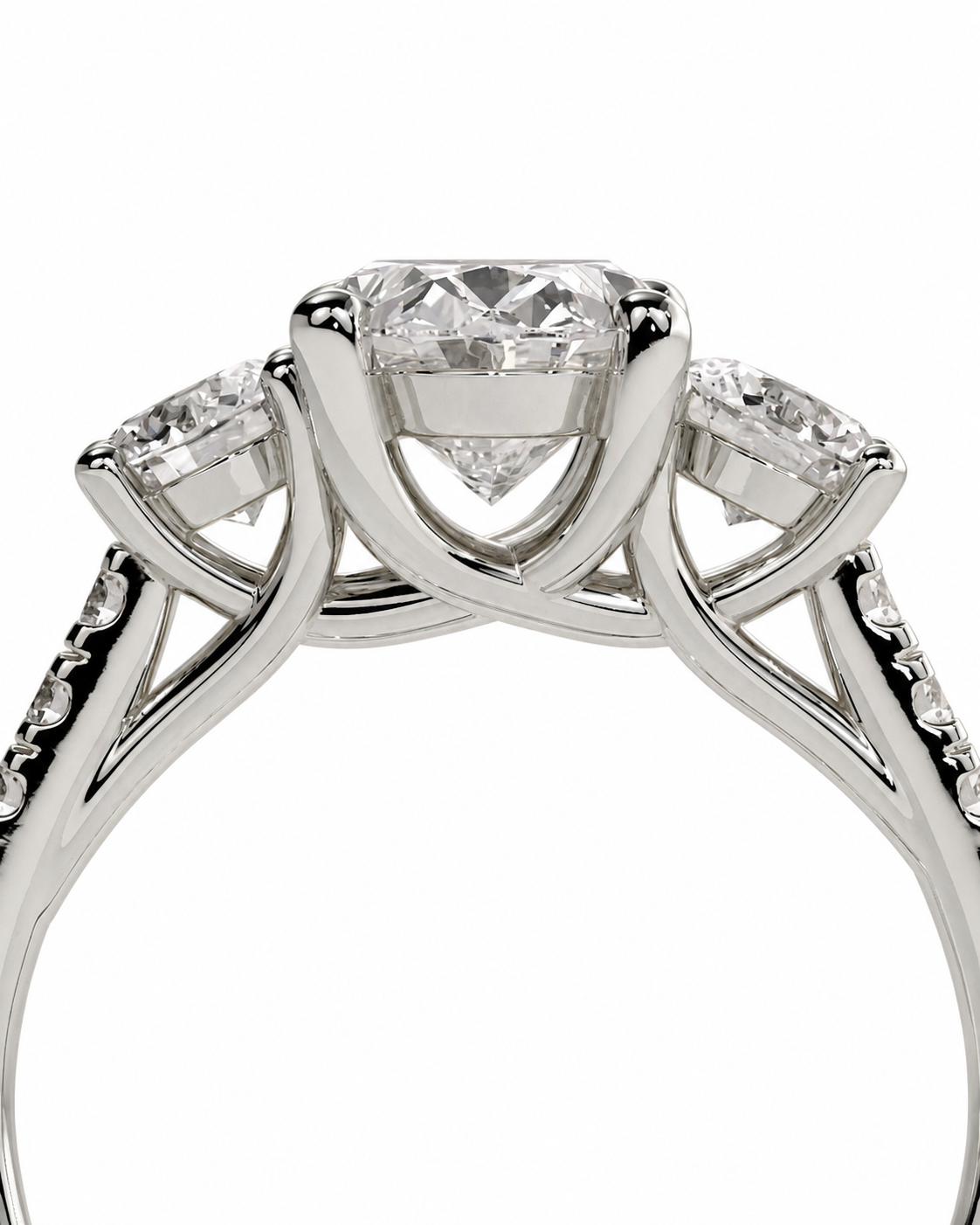 color_925_SIL,color_935_ARG,color_10K_WG, color_14K_WG &&A close-up shot of a silver-toned diamond ring featuring a central round-cut diamond surrounded by two marquise-cut diamonds on the shoulders, set against a plain white background.
