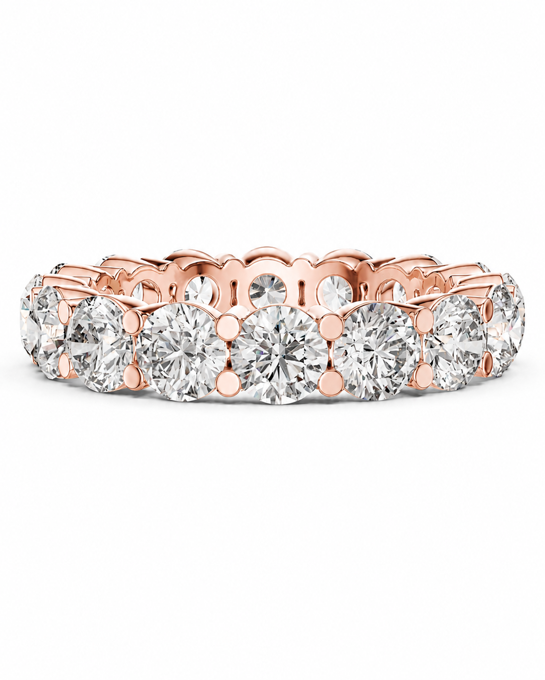 color_10K_RG, color_14K_RG &&	A rose gold eternity ring featuring a continuous row of round brilliant-cut diamonds in a prong setting, shown against a clean white background.