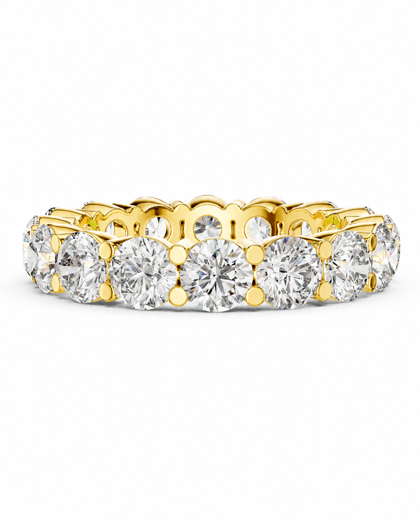 color_10K_YG, color_14K_YG &&	
A yellow gold eternity ring featuring a continuous row of round brilliant-cut diamonds in a prong setting, shown against a plain white background.