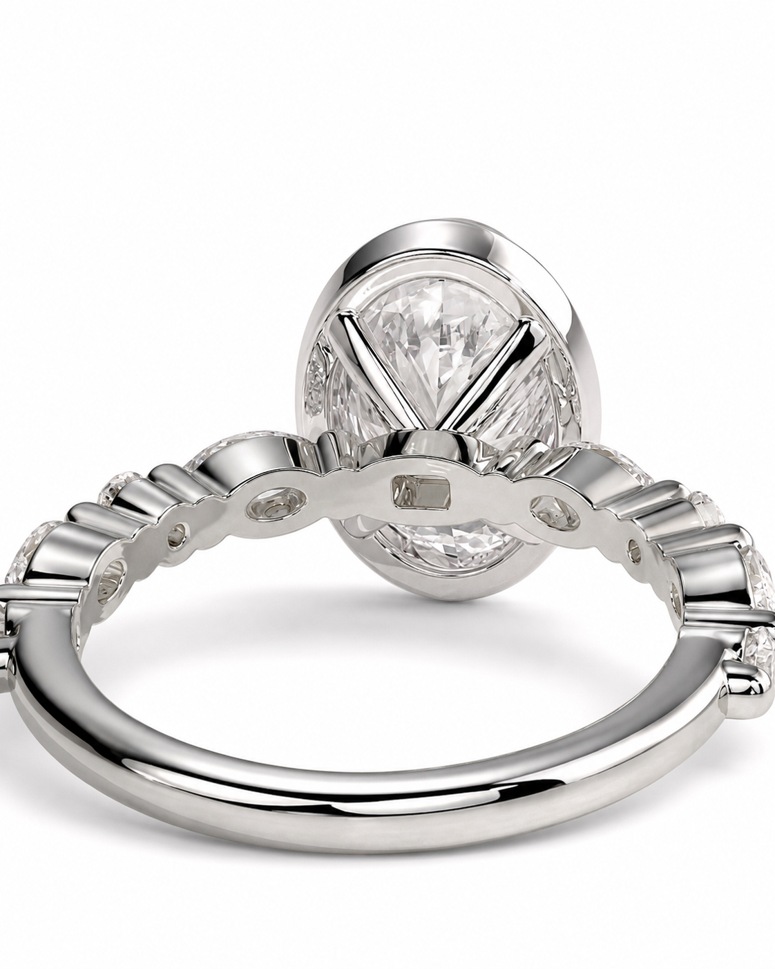 color_925_SIL,color_935_ARG,color_10K_WG, color_14K_WG &&A close-up studio shot of a silver-toned ring with a large oval clear gemstone and smaller accent stones along the band, shown on a white background.
